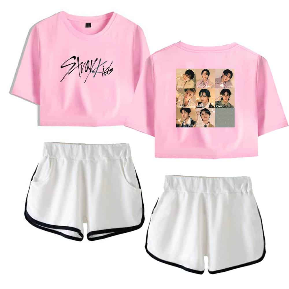 Pink K-pop T-shirt with Stray Kids logo and group photo print, paired with white sporty shorts.