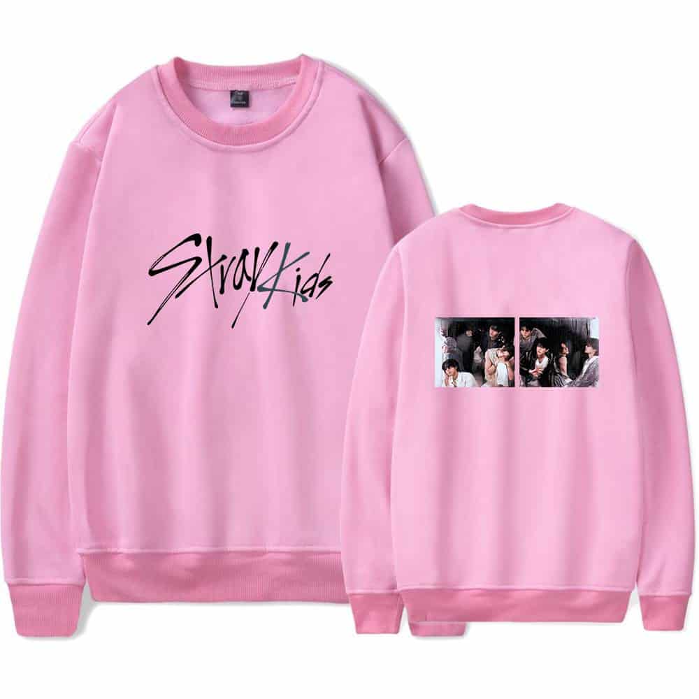 Stylish pink Stray Kids sweatshirt with band logo on front and group photo on back, perfect for Kpop merch fans.