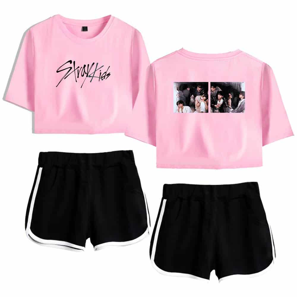 Pink K-pop girl group casual outfit with graphic tees and shorts, fashion for fans.