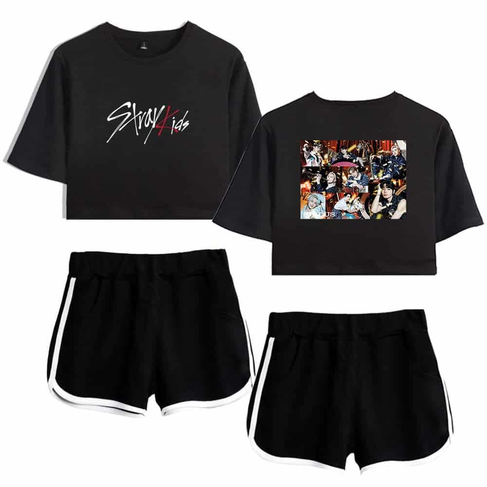 A set of black K-pop merchandise outfits, including cropped T-shirts with group graphics and black shorts with white trim. Perfect for fans to show their support and style.