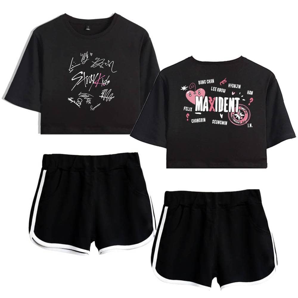 Kpop merch featuring black crop tops with band signatures and Pink and White designs paired with black shorts with white trim.