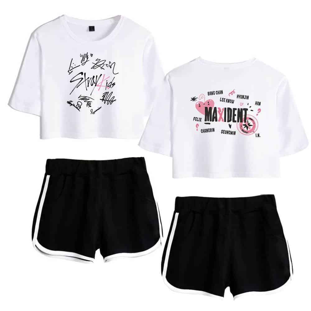 Colorful K-pop merch featuring signed graphic T-shirts and sporty black shorts with white trim.