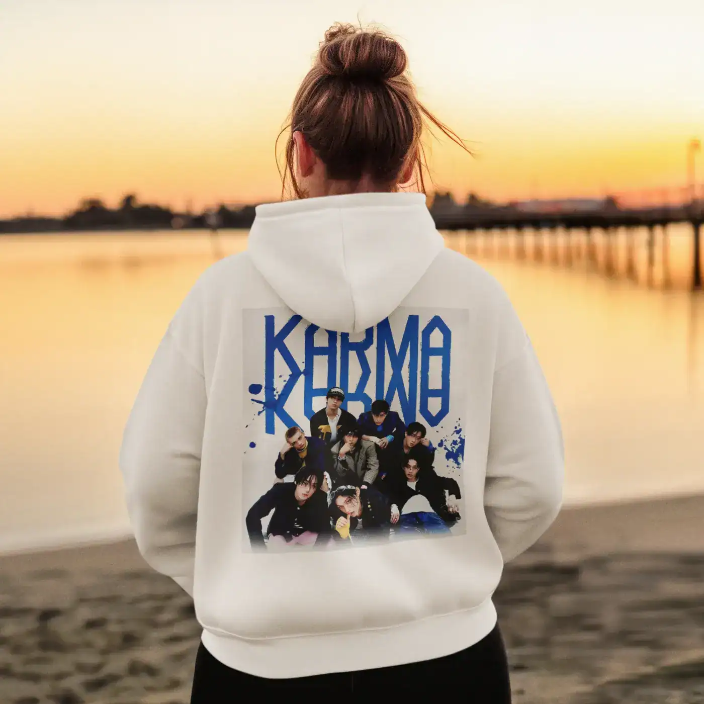 Kpop merch hoodie with a graphic print of a popular K-pop group on the back.