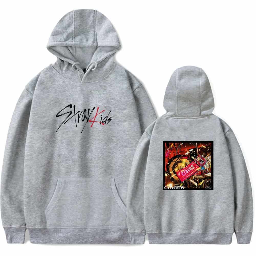 Comfortable grey hoodie with "Stay Kid" written on the front and a colorful circus-themed graphic on the back. Perfect for K-pop fans who love unique merch.